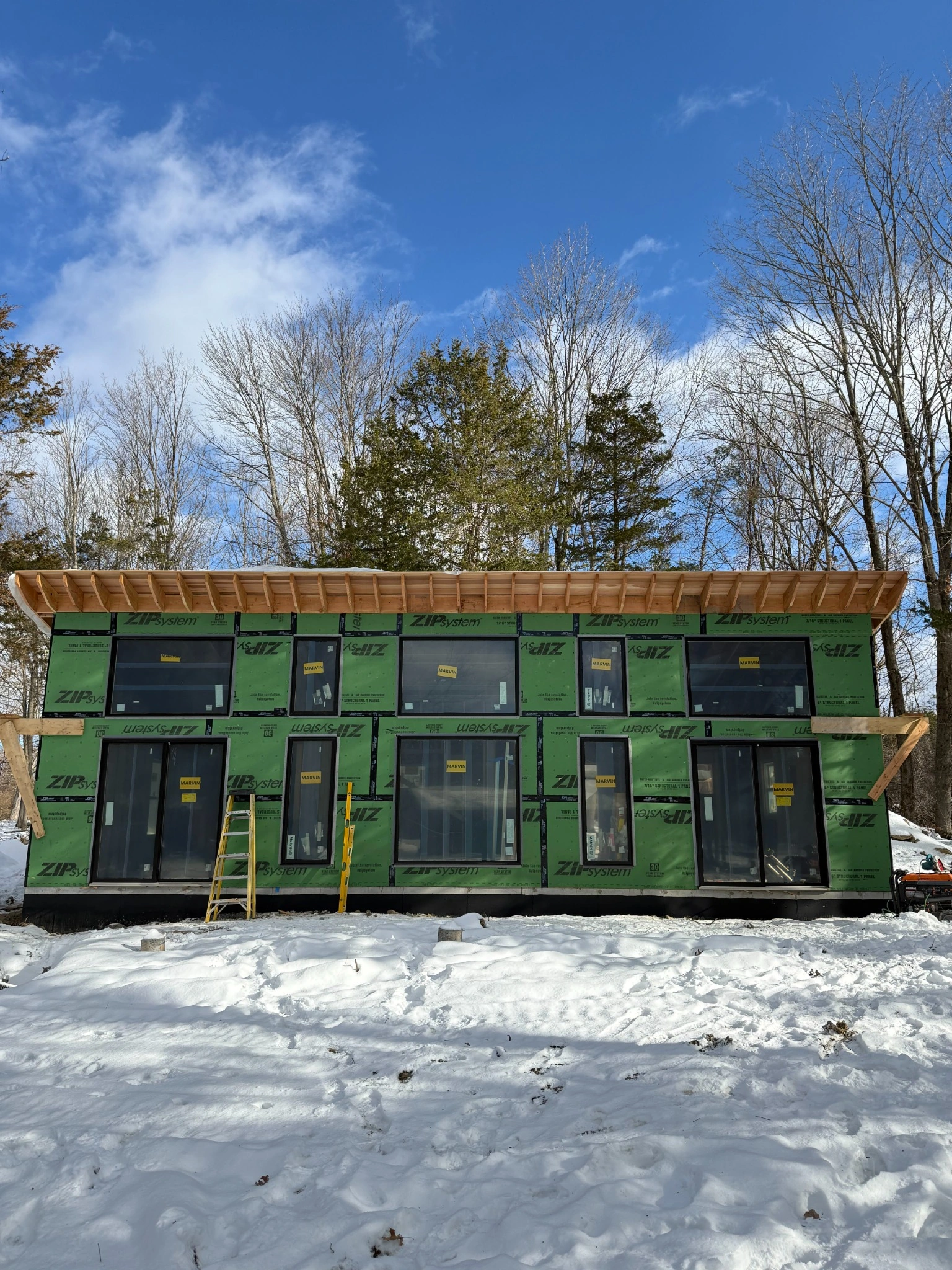 House exterior wrapped with ZIP System sheathing in winter conditions